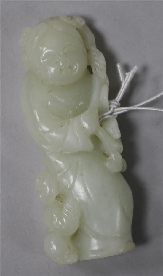 A white jade carving of a female with boy